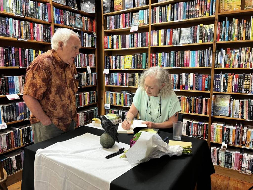 Signing a copy for my old friend, Mike Berge. (I remembered his name.) Photo by Lori Matsukawa